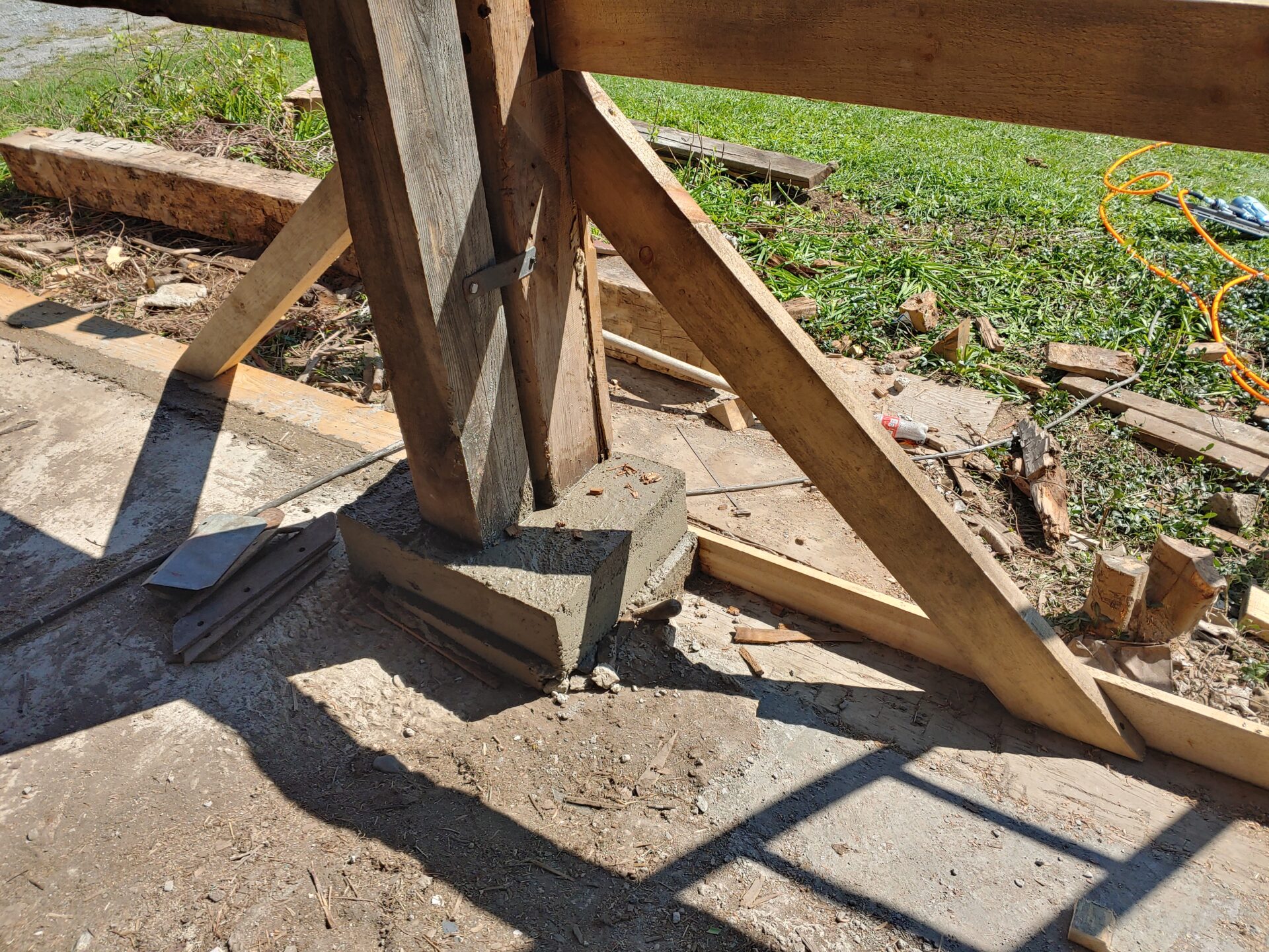 A wooden structure that has been cut off of the ground.