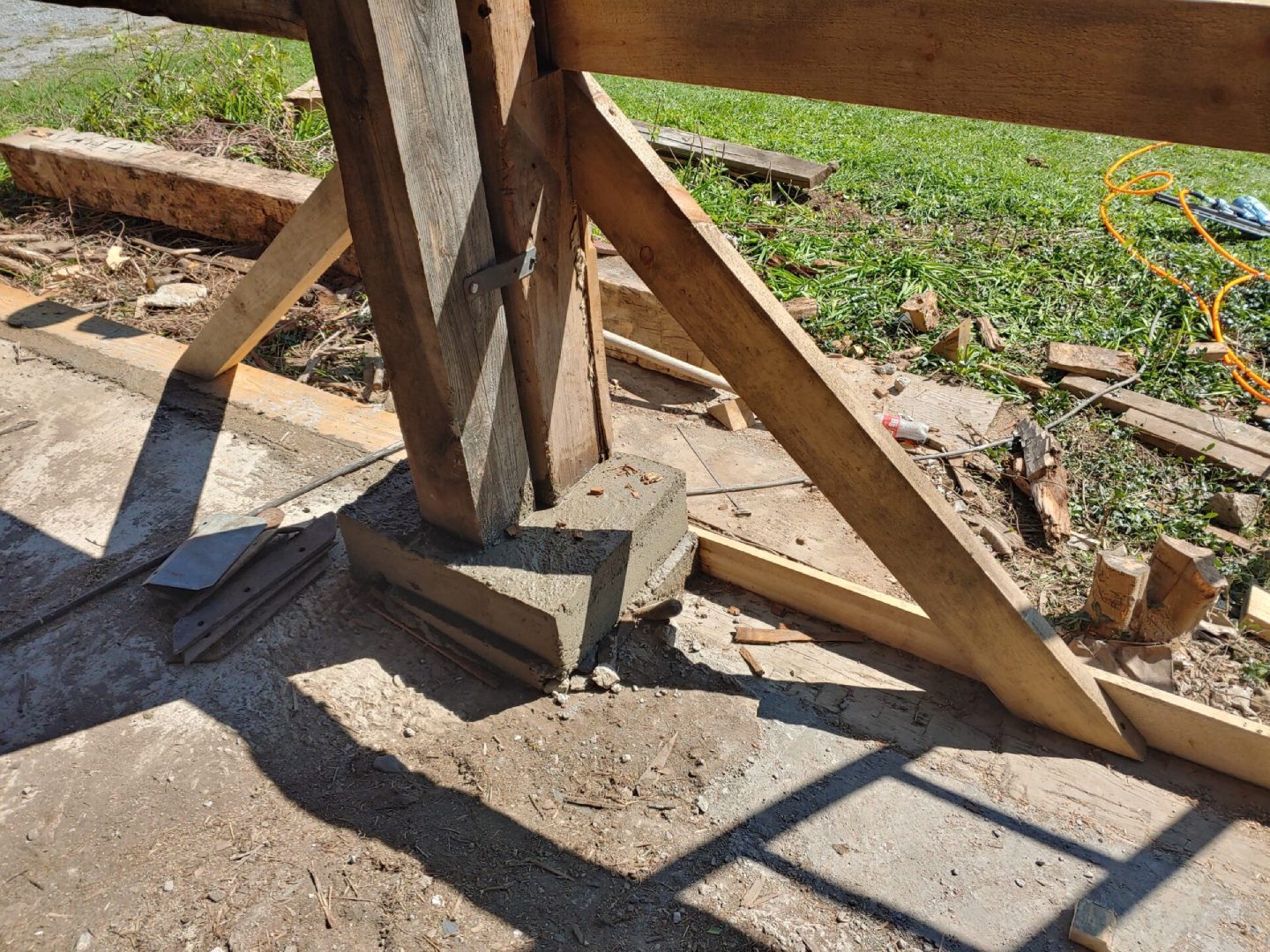 A wooden structure that has been cut off of the ground.